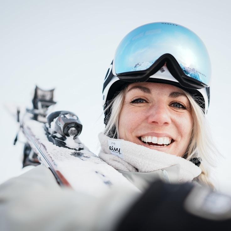 Kaveri Mehta, Lead Design Curator at GardenGrovePath, reviewing corporate floral arrangements